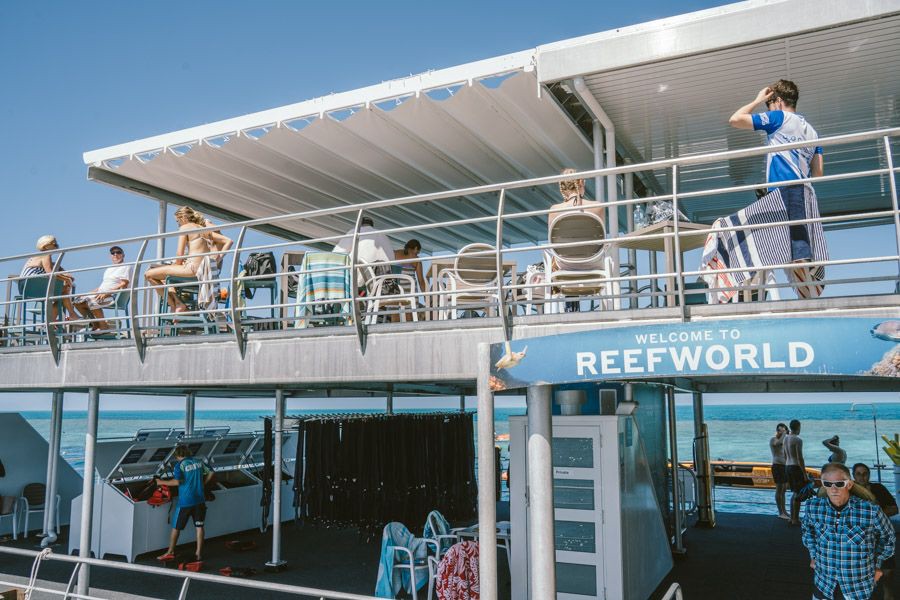 Visitors relaxing on the upper deck of Reefworld pontoon at the Great Barrier Reef in the Whitsundays