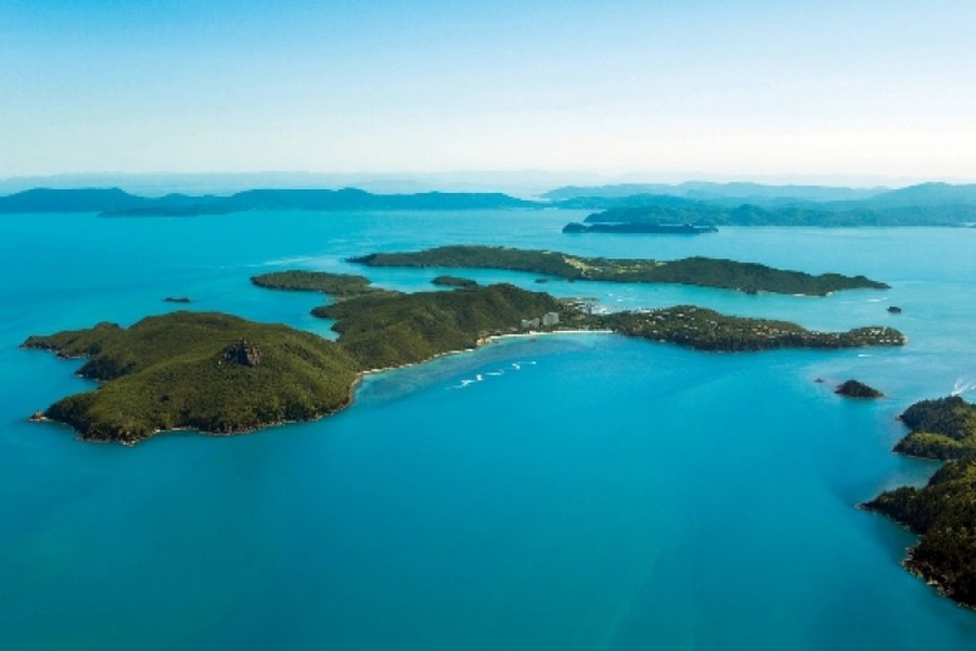 Aerial view of Hamilton Island surrounded by turquoise waters and neighbouring islands in the Whitsundays, Queensland