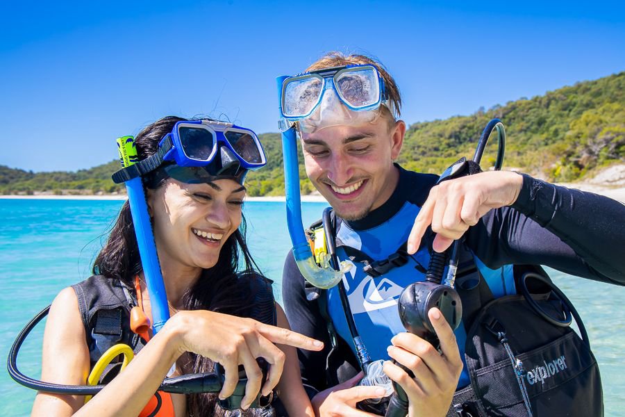 Guests checking scuba gear before a dive in the Whitsundays