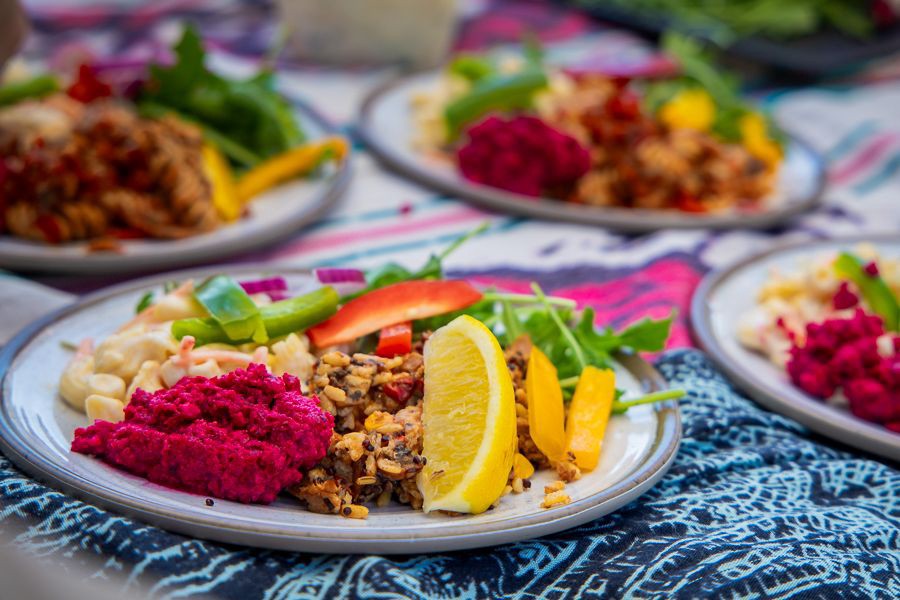 Plated gourmet lunch with salads, grains, fresh vegetables and lemon served onboard a Whitsundays sailing trip in Queensland, Australia.