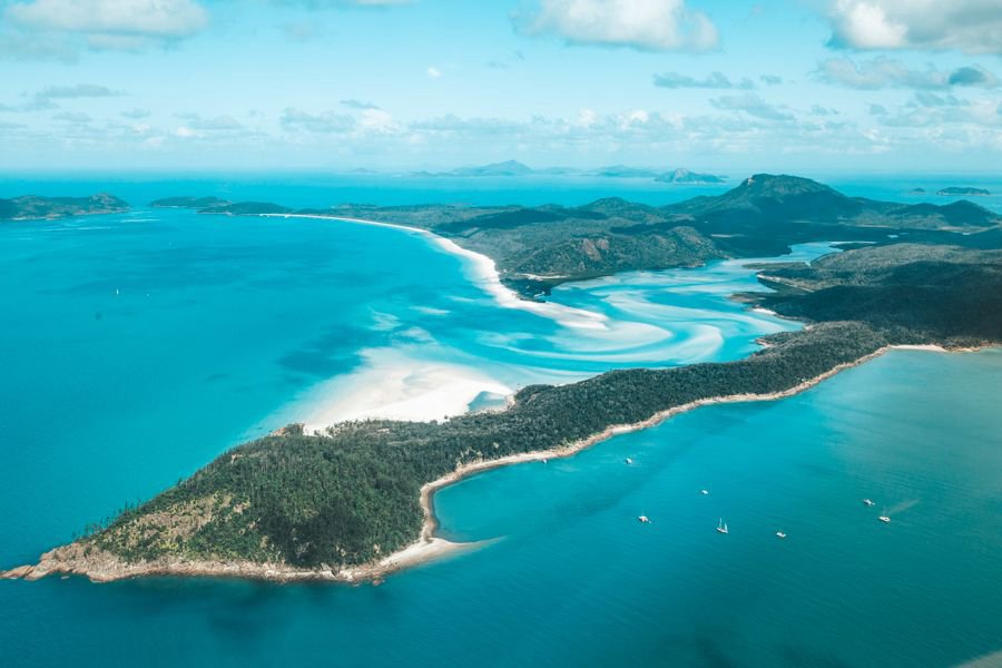 Aerial view of Whitehaven Beach and Hill Inlet with swirling white silica sands and turquoise waters in the Whitsundays.