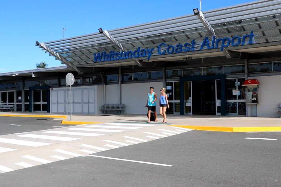 Visitors walking outside Whitsunday Coast Airport terminal in the Whitsundays