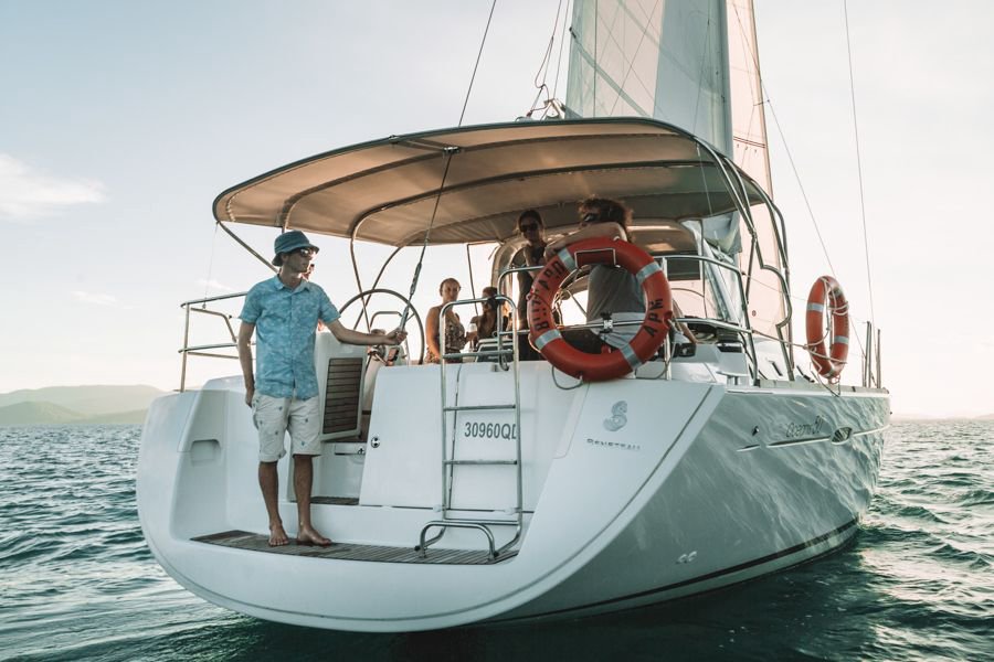 Staff and guests relaxing onboard Blizzard sailing yacht in the Whitsunday waters