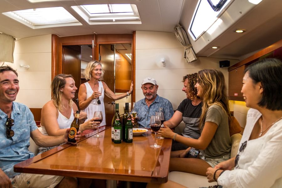 group sitting in the Blizzard saloon and chatting while on a sailing tour in the Whitsundays