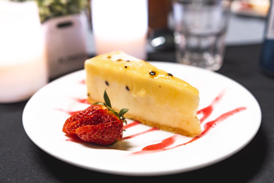 plate of passionfruit cake onboard reefworld premium pontoon