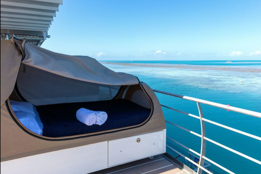 reefbed with fresh linens and towels on the reefsleep pontoon overlooking great barrier reef