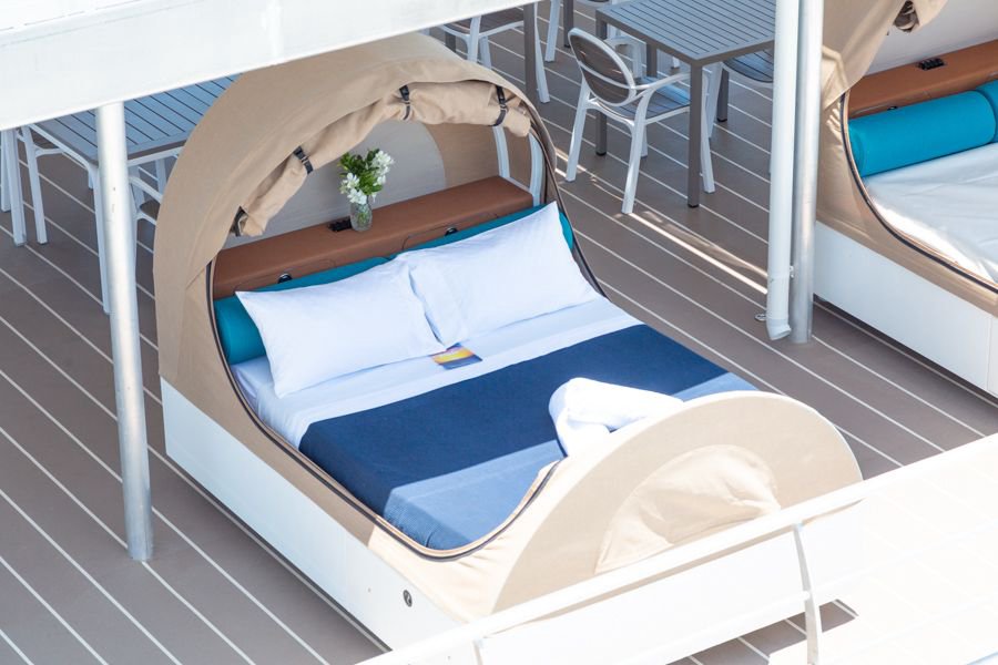 double reefbed with fresh linens and pillows outside in the sunshine on the Cruise Whitsundays Reefsleep